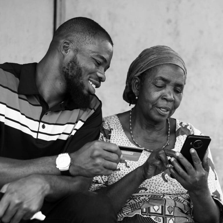 african-woman-and-man-looking-at smart-phone