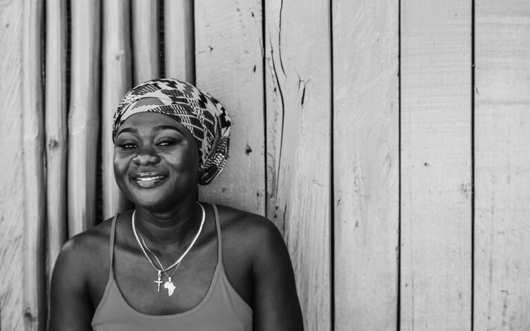 yong-african-gril-in-front-of wooden-wall